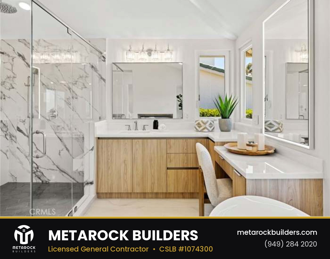 Bathroom remodel in Orange County by Metarock Builders, completed after photo with marble-look shower surround, floating oak vanity, and integrated makeup counter