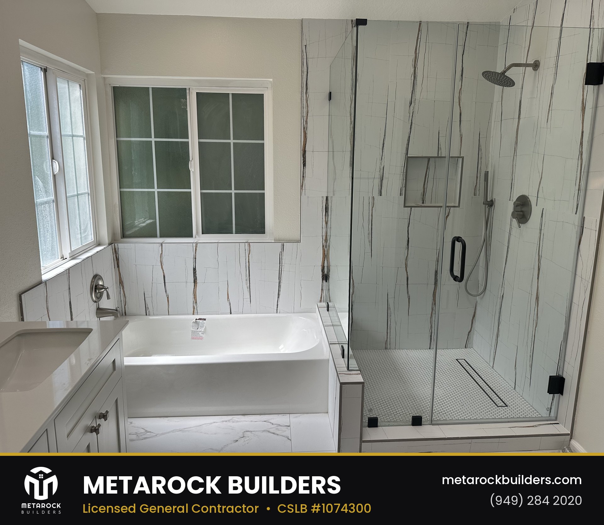 Bathroom remodel in Orange County by Metarock Builders, completed after photo with veined marble-look tile, dual-sink shaker vanity, and frameless glass shower